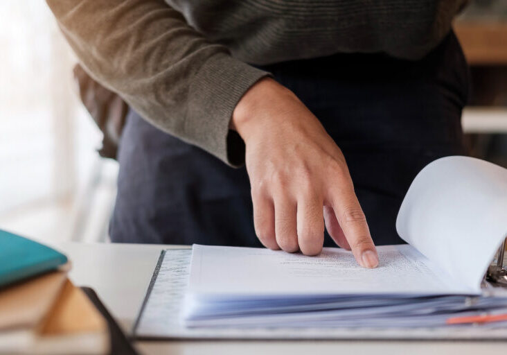 Businessman analysis meny financial documents, tax, accounting, statistics and analytic research concept.
