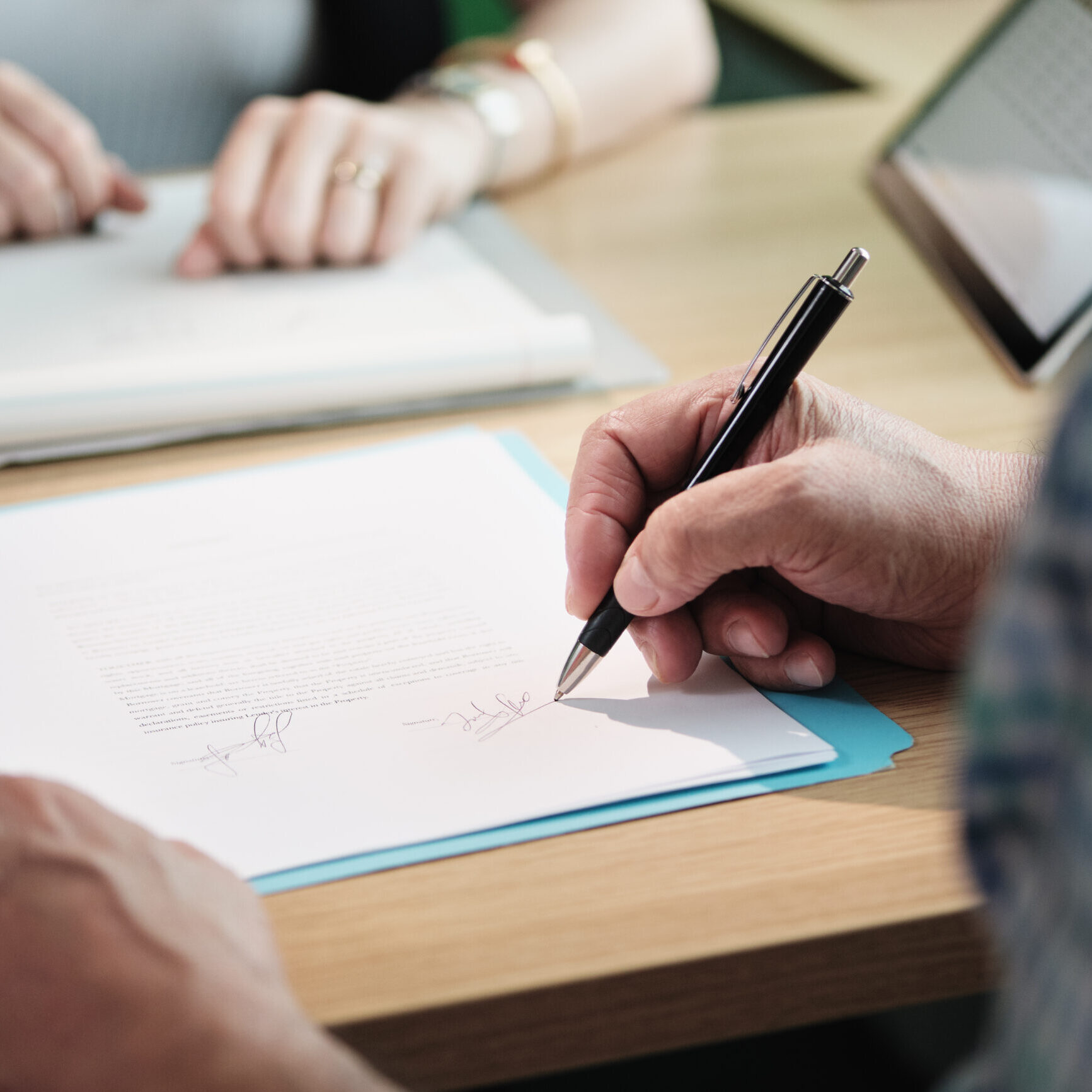 Manager Working As Banking Broker With Old Man Signing Contract Manager at work as financial consultant talking to elderly people. Senior man meeting health insurance broker or retirement plan agent for signature on agreement