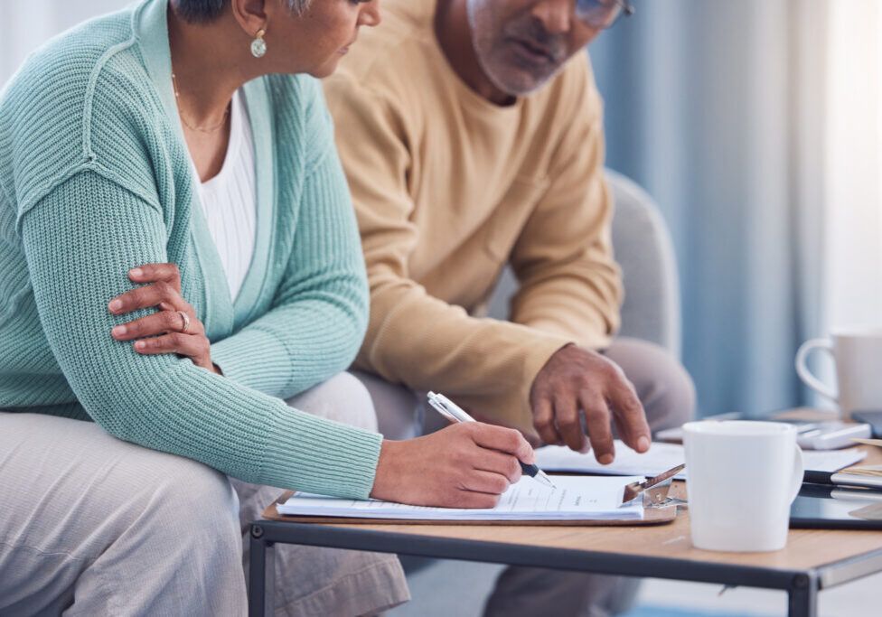 Senior couple, documents and sign contract for life insurance or home mortgage. Discussion, signatu.