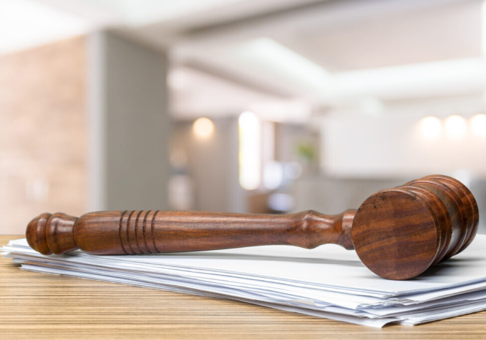 Wooden gavel on table close up. Justice concept